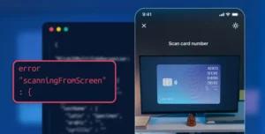 iPhone camera UI showing a monitor screen with a displayed credit card and an error message originating from the screen.