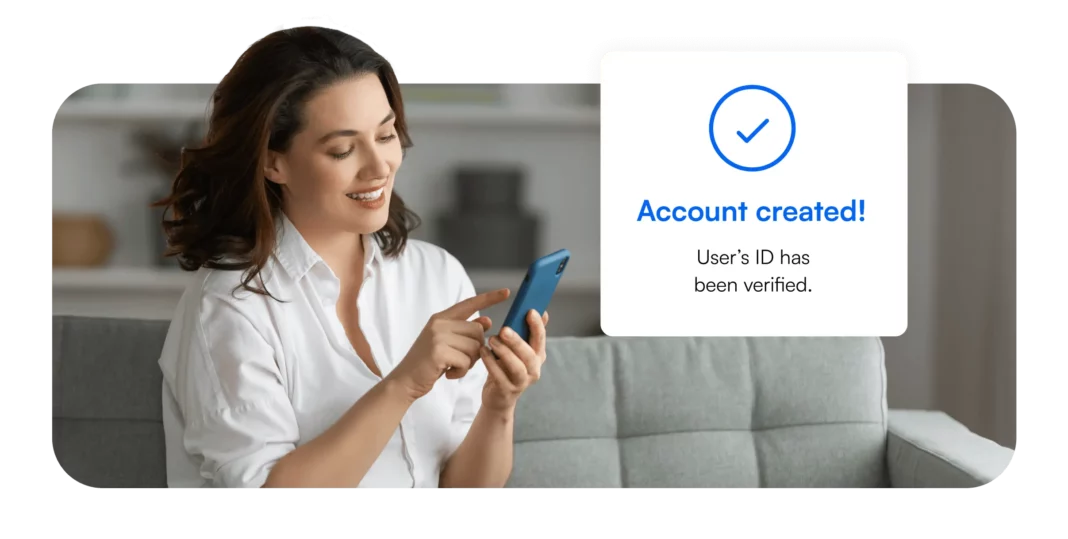 Woman looking at phone account created user's id has been verified